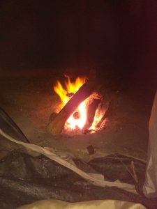 A Picture of Li Jean-Luc Harris peering out of his tent to the warmth of a fire.  Homeless Heater.  How I become homeless aged 18 and addicted to drugs. IMG 0037 225x300